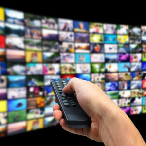 streaming video services man using remote control change channels tv closeup 1536x1044 1